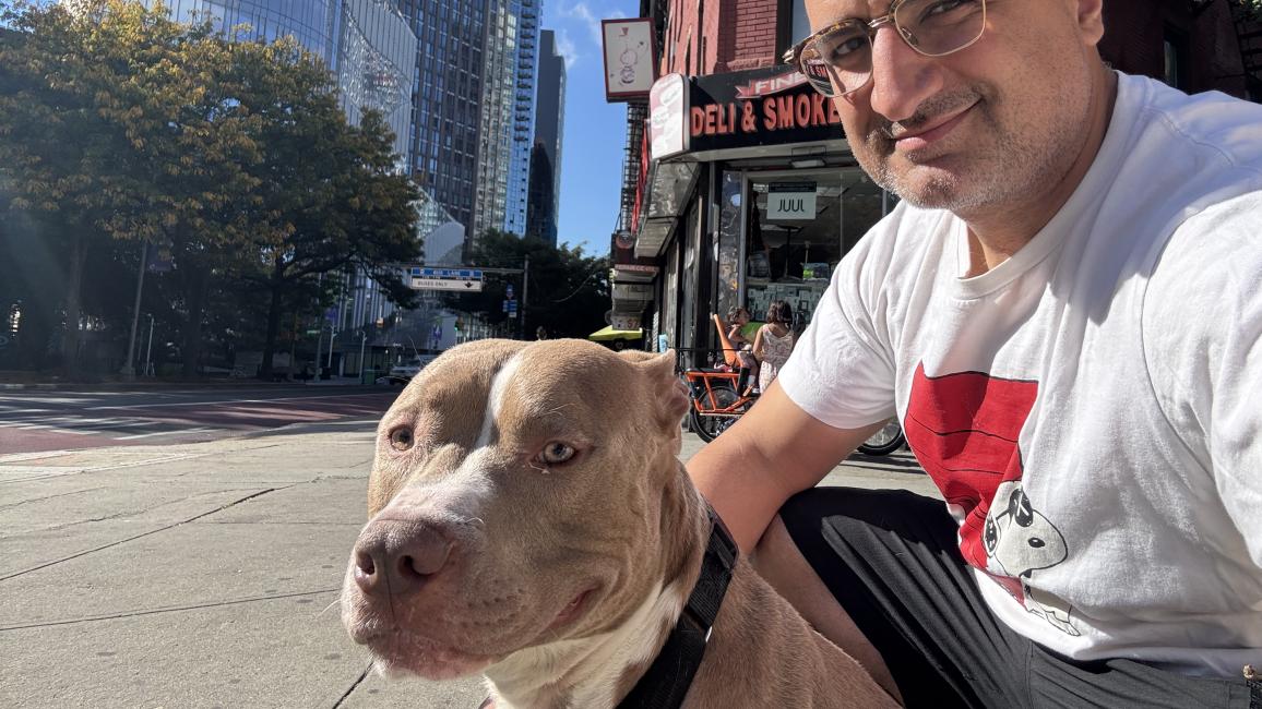 Mo outside with Cadbury the dog